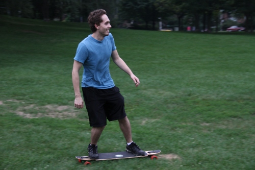 Longboard on Grass. Bottom of Withrow Park Hill